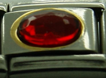 Red oval stone with gold rim - enamel charm - Click Image to Close